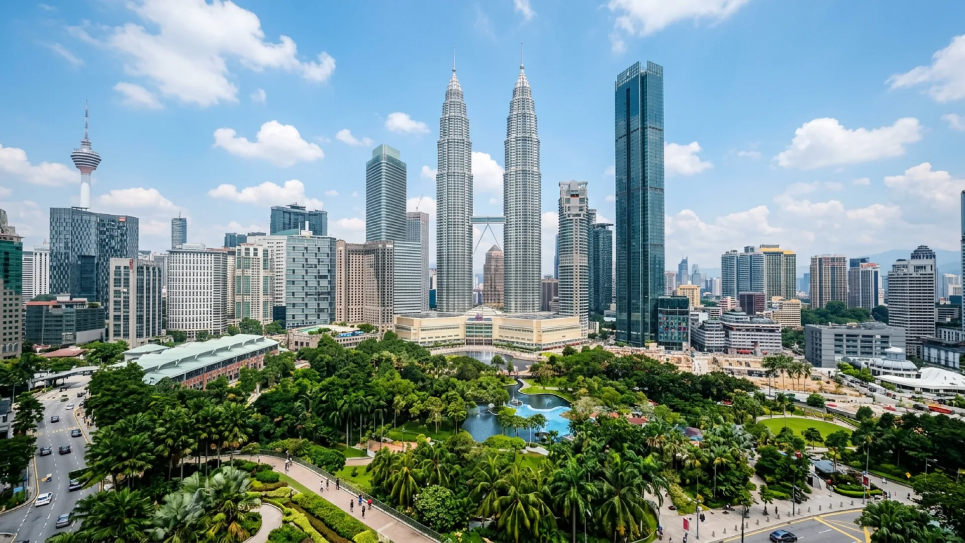 The Petronas Twin Towers above KLCC Park and the Kuala Lumpur skyline on a clear day